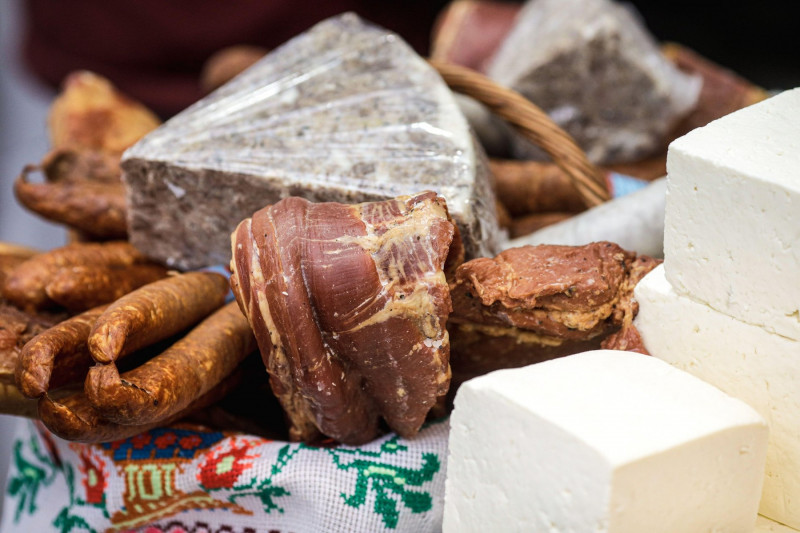 Shallow depth of field (selective focus) image with traditional Romanian winter holidays meat foods for sale in an outdoors market in Bucharest, Roman