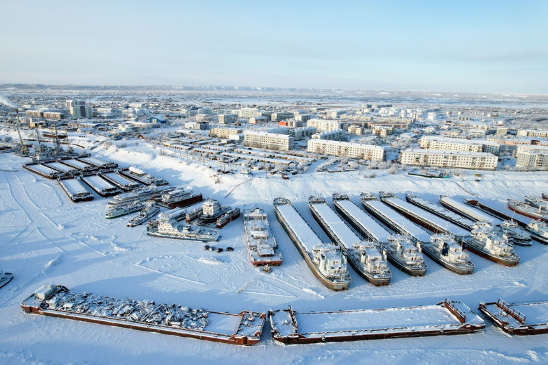 Ships under repair in winter at Zhatay Shipyard in Yakutia, Russia