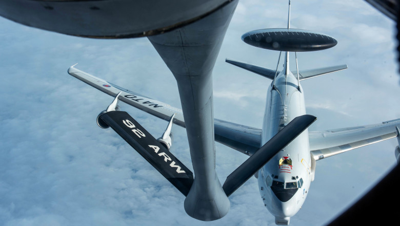An E-3 Airborne Warning and Control System (AWACS) aircraft, assigned to NATO Air Base Geilenkirchen, Germany, approaches a KC-135 Stratotanker, assigned to the 92nd Air Refueling Wing, Fairchild Air Force Base, Washington, for refueling over Romania,