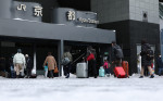 People Walk on Frozen Ground outside Kyoto Station