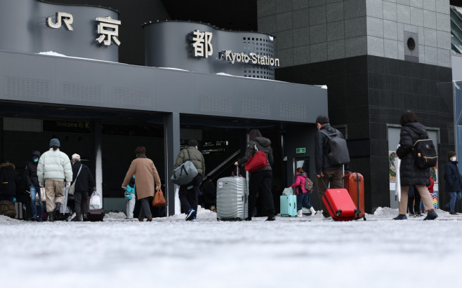 People Walk on Frozen Ground outside Kyoto Station