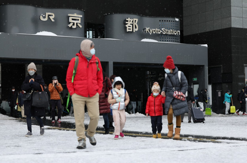 People Walk on Frozen Ground outside Kyoto Station