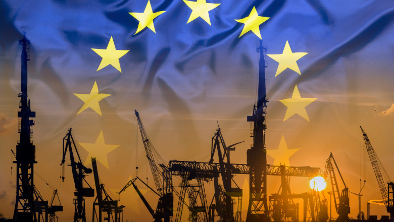 Industrial concept with European Union flag at sunset