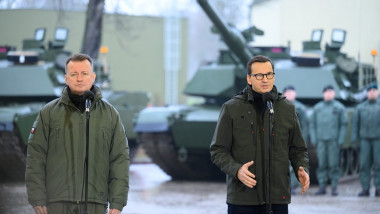 Prime Minister Mateusz Morawiecki (R), Deputy Prime Minister, Minister of National Defense Mariusz Blaszczak (L) during a meeting with soldiers