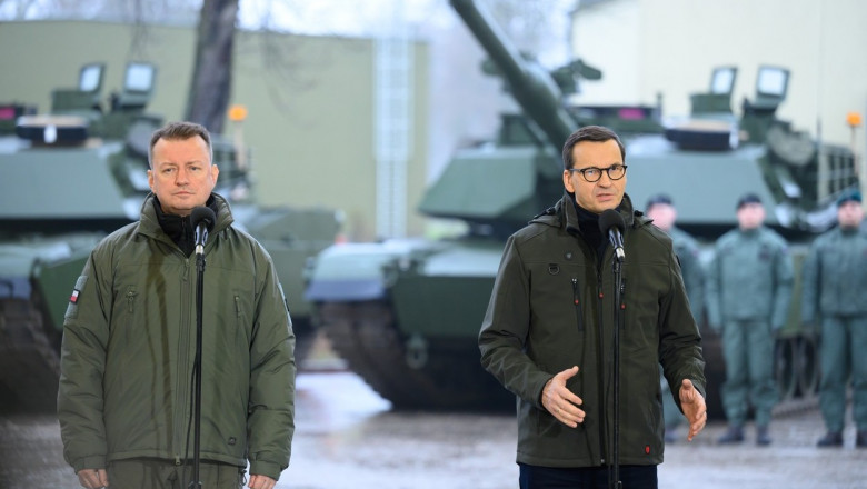 Prime Minister Mateusz Morawiecki (R), Deputy Prime Minister, Minister of National Defense Mariusz Blaszczak (L) during a meeting with soldiers