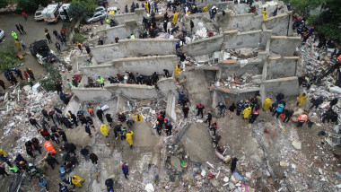 An aerial view shows search and rescue operation carried out at the debris of a building in Cukurova district of Adana after a 7.4 magnitude earthquake hit southern provinces of Turkiye, in Adana