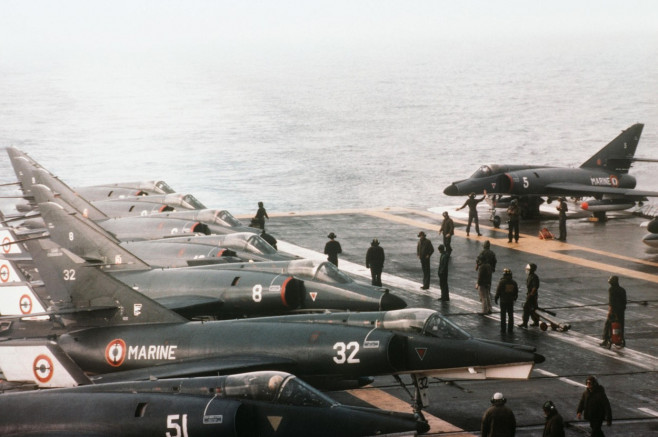 A group of Super Entendard aircraft line the aft flight deck of the French aircraft carrier FOCH (R-99). The FOCH is deployed off the coast of Lebanon. %%C3%%89tendard IVM and Super %%C3%%89tendard aboard Foch (R99) 1983