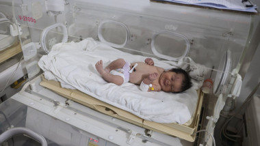 Afrin, Syria. 08th Feb, 2023. A newborn girl lies inside an incubator as part of her medical checkup at a children's hospital in the Syrian town of Afrin. Aya, the so-called 'miracle baby', was rescued from underneath a destroyed house, with her umbilical