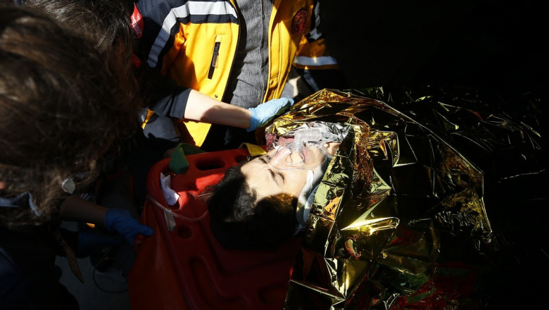 A person taken to an ambulance after being rescued from under the rubble of a collapsed building in Turkey