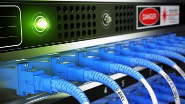 Close up of optical fiber optic active and passive equipment inside a network infrastructure