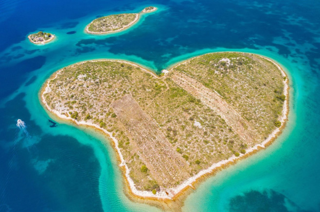 Croatia, beautiful coastline on Adriatic sea, romantic heart shaped island of Galesnjak in turquoise sea in Murter archipelago, aerial view of from dr