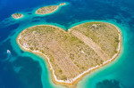 Croatia, beautiful coastline on Adriatic sea, romantic heart shaped island of Galesnjak in turquoise sea in Murter archipelago, aerial view of from dr