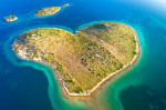 Heart shaped island of Galesnjak in Zadar archipelago aerial view, Dalmatia region of Croatia