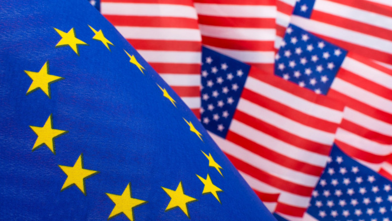 Stars and Stripes &amp; EU flag. Metaphor Trump Trade Tariffs on EU imports to USA, Trump steel tariffs, US-EU trade war, US-EU trade barrier, US EU flags