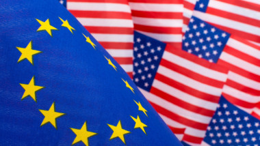 Stars and Stripes &amp; EU flag. Metaphor Trump Trade Tariffs on EU imports to USA, Trump steel tariffs, US-EU trade war, US-EU trade barrier, US EU flags