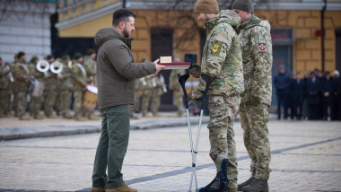 Ukrainian President Volodymyr Zelensky awarding a serviceman during a ceremony at St Sophia Square in Kyiv