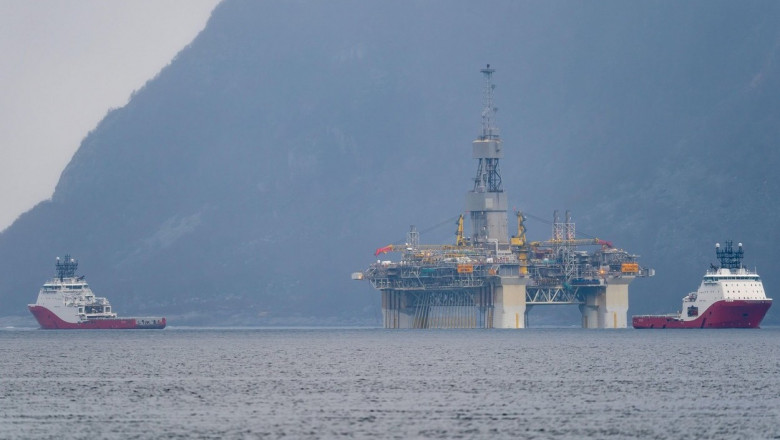 Rig move of Equinor oil platform Njord Alpha with ahts vessels Siem Pearl and Siem Opal inside the Norwegian fjord.