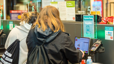 Cottbus, Germany. 14th Feb, 2023. Customers scan and pay for their purchases at a self-service checkout in a grocery supermarket. Credit: Frank Hammerschmidt/dpa/Alamy Live News