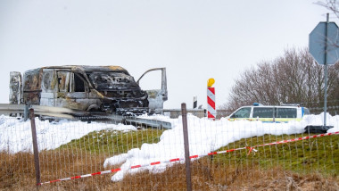 burnt-out cash-in-transit van stands at the Gützkow junction, germany