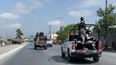 National Guard and military vehicles take part in an operation to transfer two of the four US citizens kidnapped in Mexico's crime-ridden northeast, back to Brownsville in the US