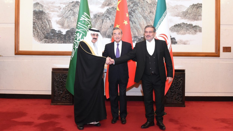 a member of the Political Bureau of the Communist Party of China (CPC) Central Committee and director of the Office of the Foreign Affairs Commission of the CPC Central Committee, attends a closing meeting of the talks between the Saudi delegation led by Musaad bin Mohammed Al-Aiban (L), Saudi Arabia's Minister of State, Member of the Council of Ministers and National Security Advisor, and Iranian delegation led by Admiral Ali Shamkhani (R), Secretary of the Supreme National Security Council of Iran, in Beijing, capital of China, March 10, 2023.