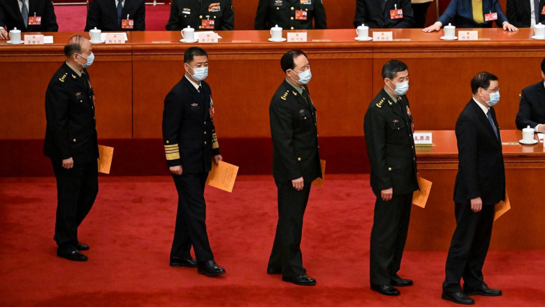 Military delegates (C) prepare to vote during the fifth plenary session of the National People's Congress (NPC) at the Great Hall of the People in Beijing