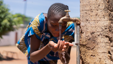 Candid picture of African Black Girl Drinking Water Bamako Mali