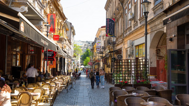 Bucharest, Rumania - 28.04.2018: Tourists in Old Town and Restaurants on Downtown Lipscani Street, one of the most busiest streets of central Bucharest