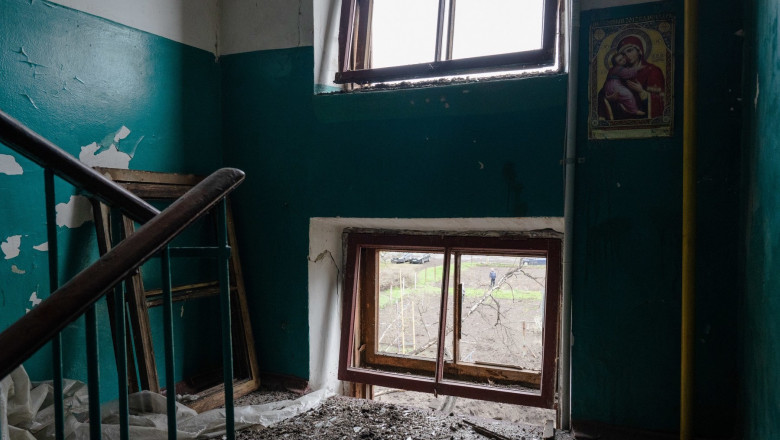 A poster of the church calendar of 2012 is seen on the wall of a damaged building in Sloviansk.