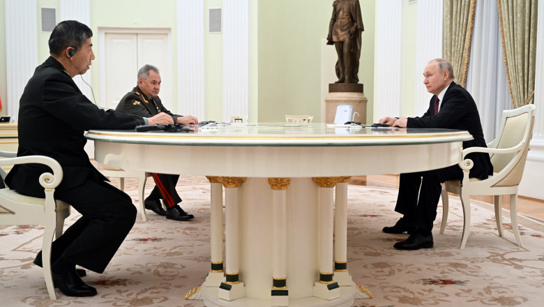Russian President Vladimir Putin, Chinese Defense Minister Gen. Li Shangfu, left, and Russian Defence Minister Sergei Shoigu meet at the Kremlin in Moscow, Russia