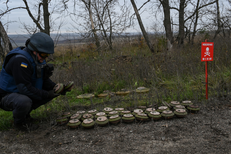 Ukraine: Bomb disposal technicians of the Ukrainian Department of Emergency Services remove and disarm anti-tank mines in the fields South of the city of Izyum
