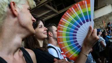 A participant holds a fan with rainbow colours during the lesbian, gay, bisexual and transgender (LGBT) Pride Parade in Budapest