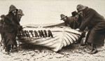 Hauling one of the 'Lusitania's' lifeboats onto the beach, Ireland, 8 May 1915. Artist: Clarke &amp; Hyde