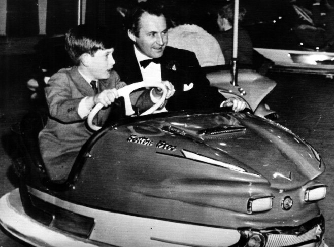 English Prince Charles Prince of Wales,Prince Charles rides in a bumper car with David Monk.18 December 1959