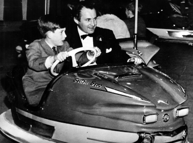 English Prince Charles Prince of Wales,Prince Charles rides in a bumper car with David Monk.18 December 1959