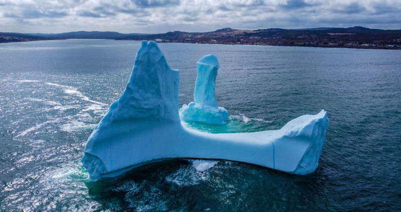 EXCLUSIVE: VIDEO: Huge WILLY-shaped ICEBERG floats past town called DILDO