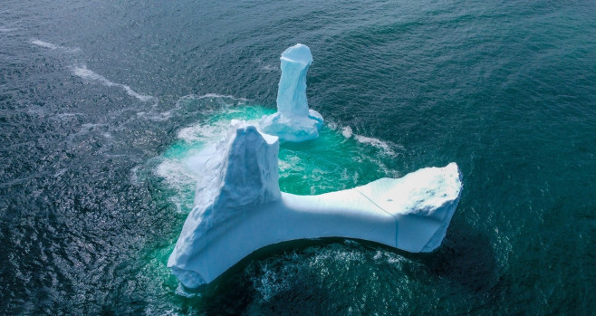 EXCLUSIVE: VIDEO: Huge WILLY-shaped ICEBERG floats past town called DILDO