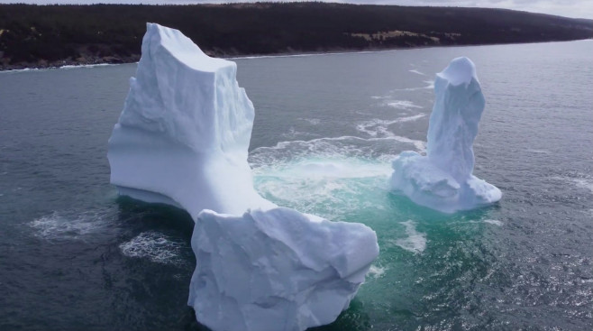 EXCLUSIVE: VIDEO: Huge WILLY-shaped ICEBERG floats past town called DILDO