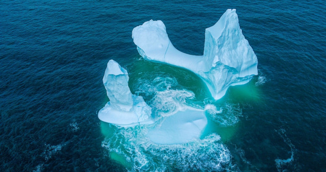 EXCLUSIVE: VIDEO: Huge WILLY-shaped ICEBERG floats past town called DILDO