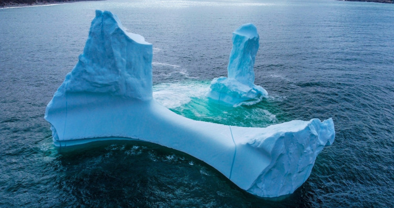 EXCLUSIVE: VIDEO: Huge WILLY-shaped ICEBERG floats past town called DILDO