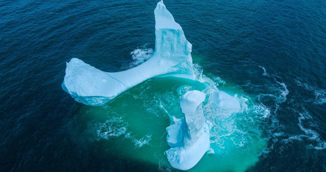 EXCLUSIVE: VIDEO: Huge WILLY-shaped ICEBERG floats past town called DILDO