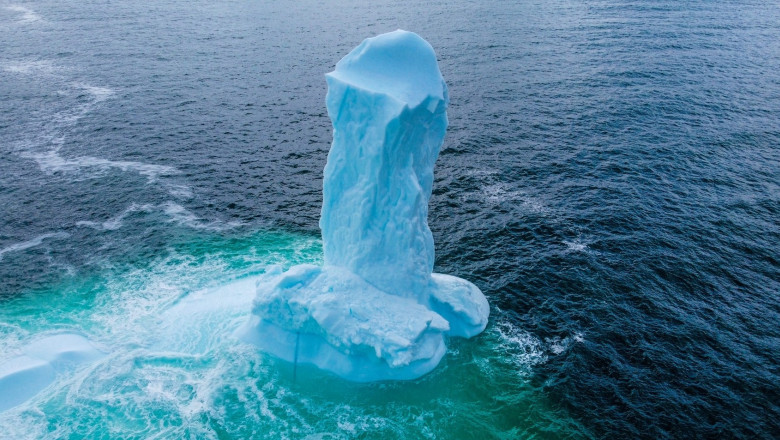 EXCLUSIVE: VIDEO: Huge WILLY-shaped ICEBERG floats past town called DILDO