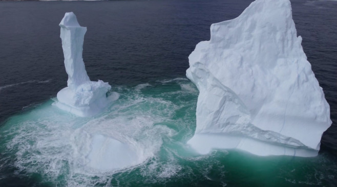 EXCLUSIVE: VIDEO: Huge WILLY-shaped ICEBERG floats past town called DILDO