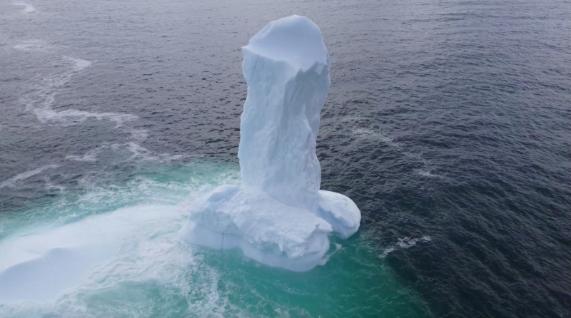 EXCLUSIVE: VIDEO: Huge WILLY-shaped ICEBERG floats past town called DILDO