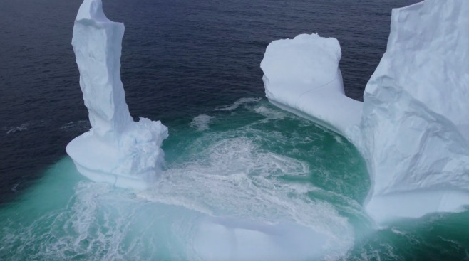 EXCLUSIVE: VIDEO: Huge WILLY-shaped ICEBERG floats past town called DILDO