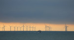 Hove, UK. 26th Nov, 2020. The Rampion Offshore Wind Farm is seen in the distance as the light begins to fade off the Sussex coast. Credit: James Boardman/Alamy Live News