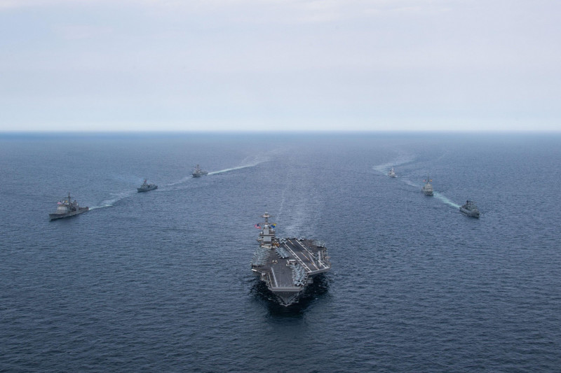 The Gerald R. Ford Carrier Strike Group sails in formation during a passing exercise with Standing NATO Maritime Group 1, May 21, 2023. The ships sailing include the first-in-class aircraft carrier USS Gerald R. Ford (CVN 78), Ticonderoga class guided-mis