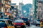 Street view of Siaka Steven Street and the historical Cotton tree in Freetown city, Sierra Leone