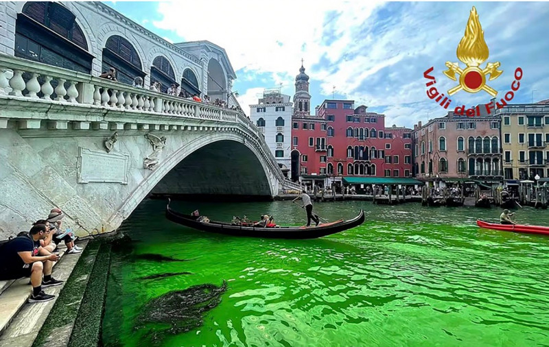 Italy, Venice: Water turns fluorescent green in Canal Grande. Police investigating