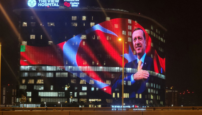 Turkish President Erdogan and Turkish Flag projected on The View Hospital in Doha after Turkiye’s presidential runoff election
